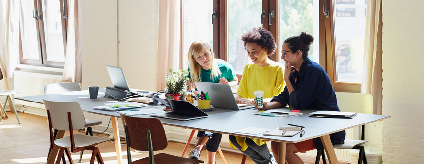Group of people reviewing a computer
